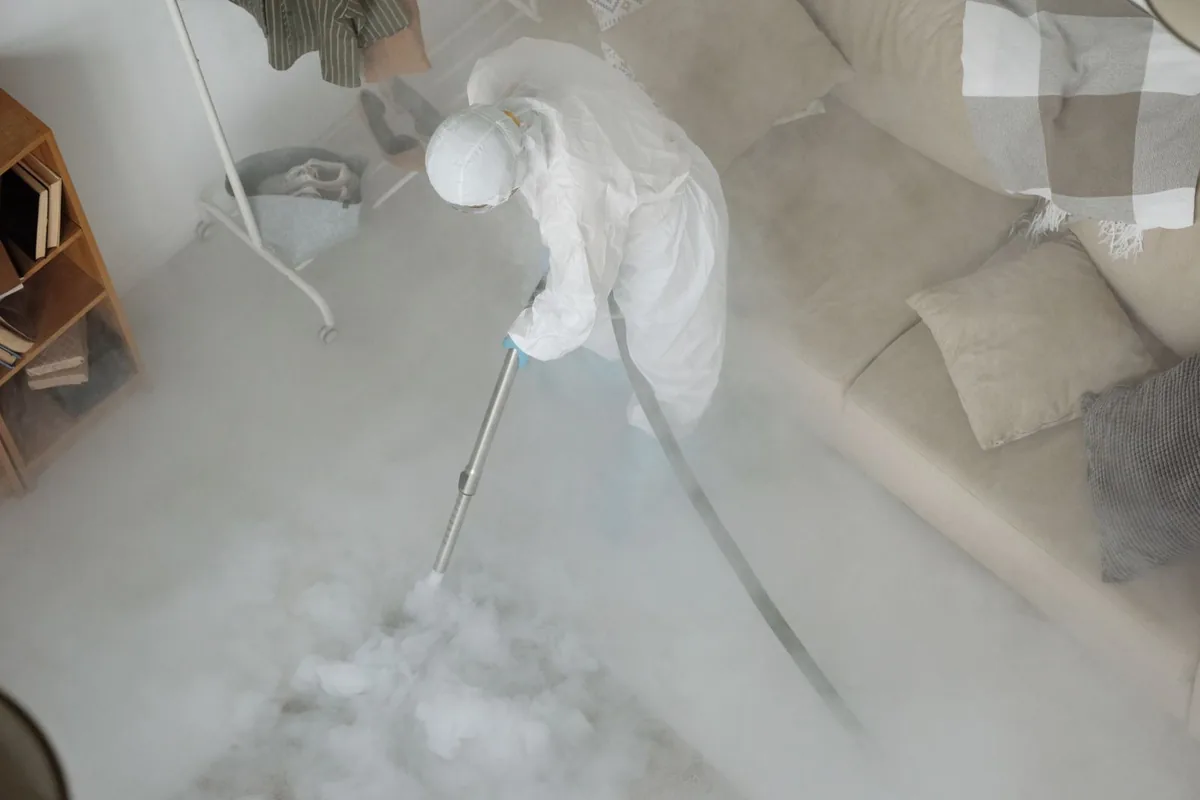 Biohazard cleanup technician in protective equipment, Shenandoah, PA